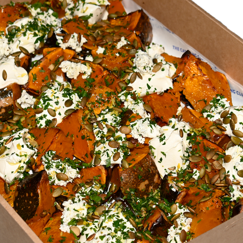 Roast Japanese pumpkin platter with activated pumpkin seeds, aged feta, and gremolata, perfect for vegan and gluten-free catering in Sydney.
