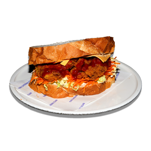 Spicy fried chicken sandwich with crumbed chicken, Sriracha, hot sauce aioli, slaw, and American cheese, perfect for spicy food lovers in Sydney.