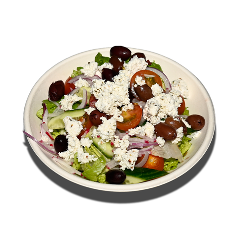 Greek salad with baby cos, barrel-aged feta, cherry tomatoes, cucumber, olives, and lemon olive oil dressing, perfect for vegan and gluten-free catering in Sydney.