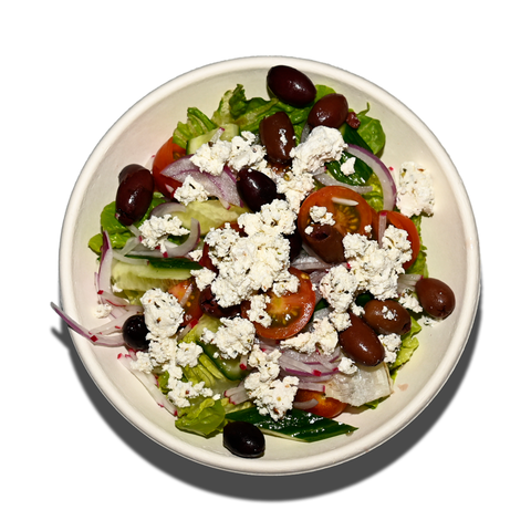 Greek salad with baby cos, barrel-aged feta, cherry tomatoes, cucumber, olives, and lemon olive oil dressing, perfect for vegan and gluten-free catering in Sydney.